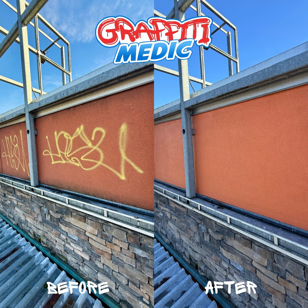 Yellow spray tag removed from painted stucco parapet wall — Graffiti Medic before and after