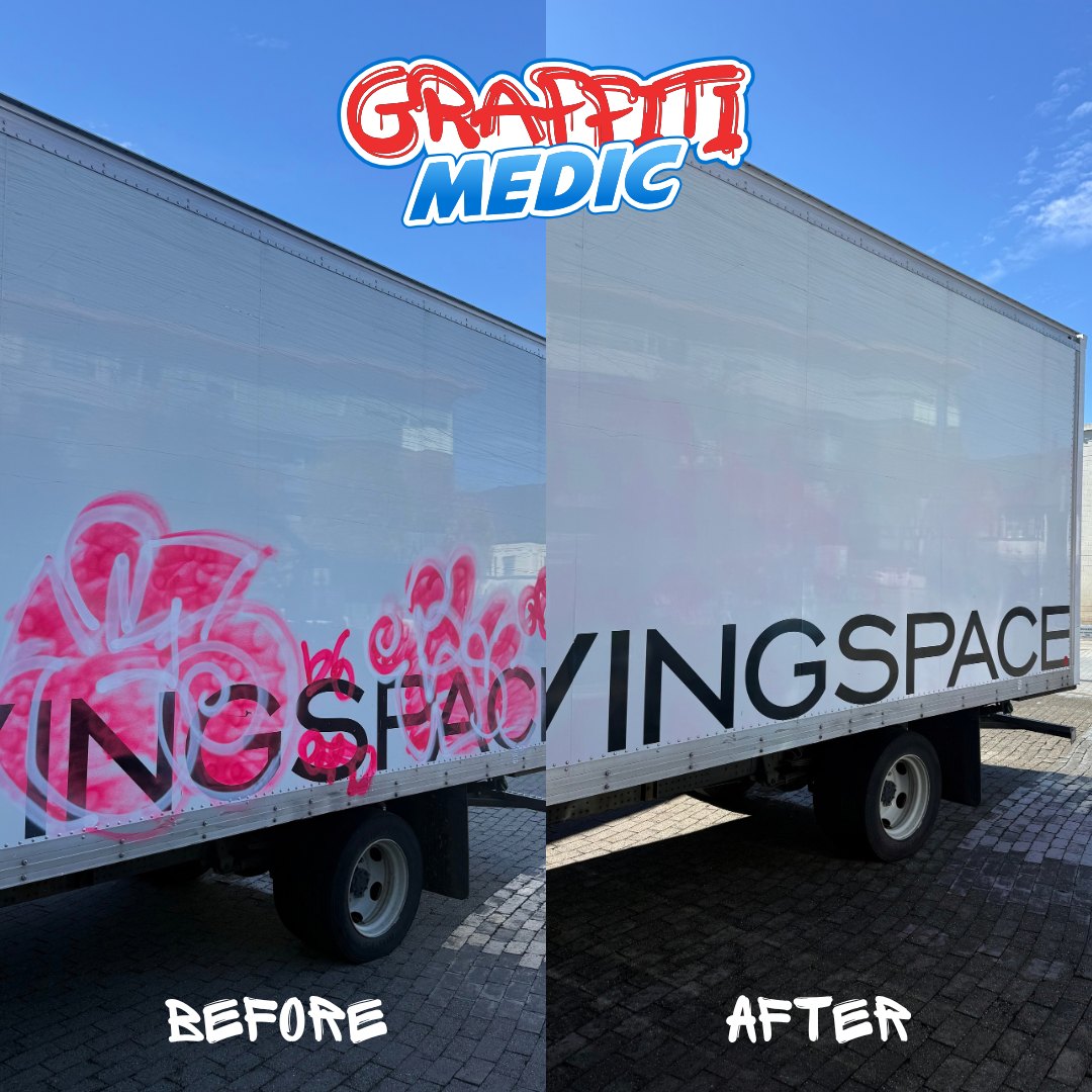 Large tag removed from box truck side with graphics intact — Graffiti Medic fleet removal